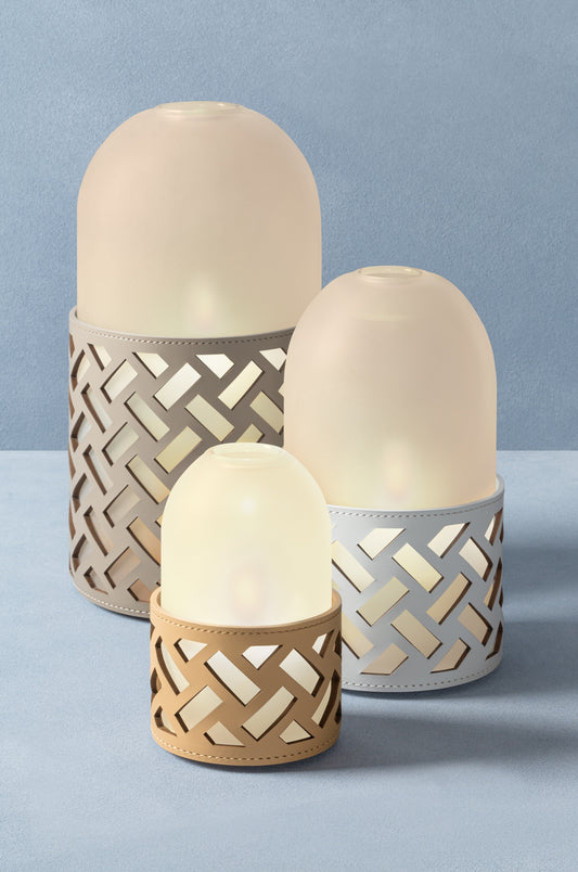 Hotaru N°2 Lantern by RUDI | Finest regenerated leather base with a perforated dynamic motif | Water-resistant and UV-resistant finish | Removable frosted borosilicate glass cap for a subtle, diffused glow | Versatile accent piece to create enchanting atmospheres | Home Decor and Lighting | 2Jour Concierge, your luxury lifestyle shop






