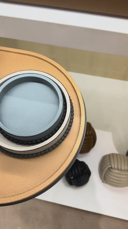 Giobagnara | Perla Round Trinket Box: Leather-covered round box with lid and metal ring of linked spheres | Decor | 2Jour Concierge, your luxury lifestyle shop | luxury trinket box, Giobagnara Perla, round leather box, Italian designer box, leather storage box